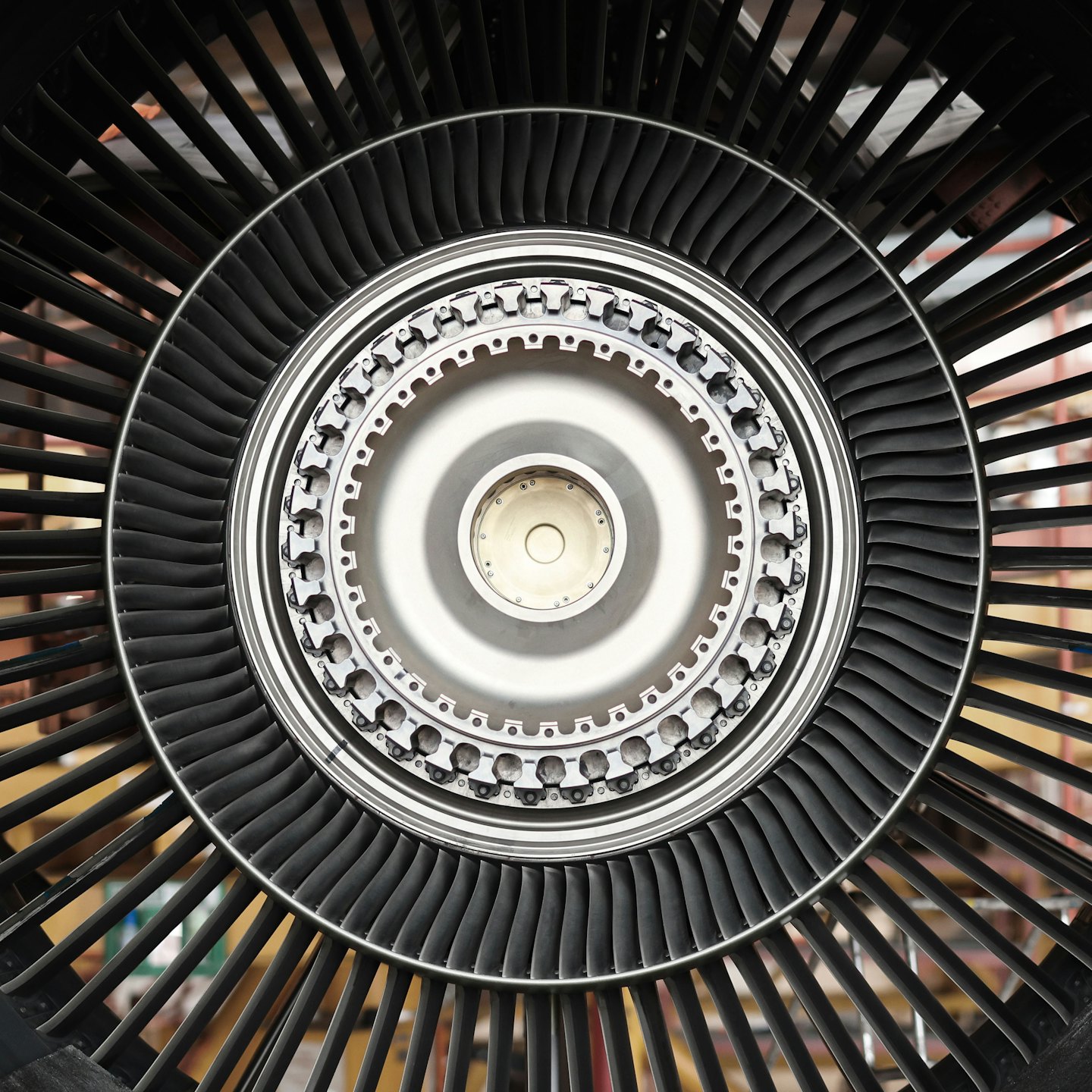 Detailed jet engine turbine blades arranged in a spiral pattern.